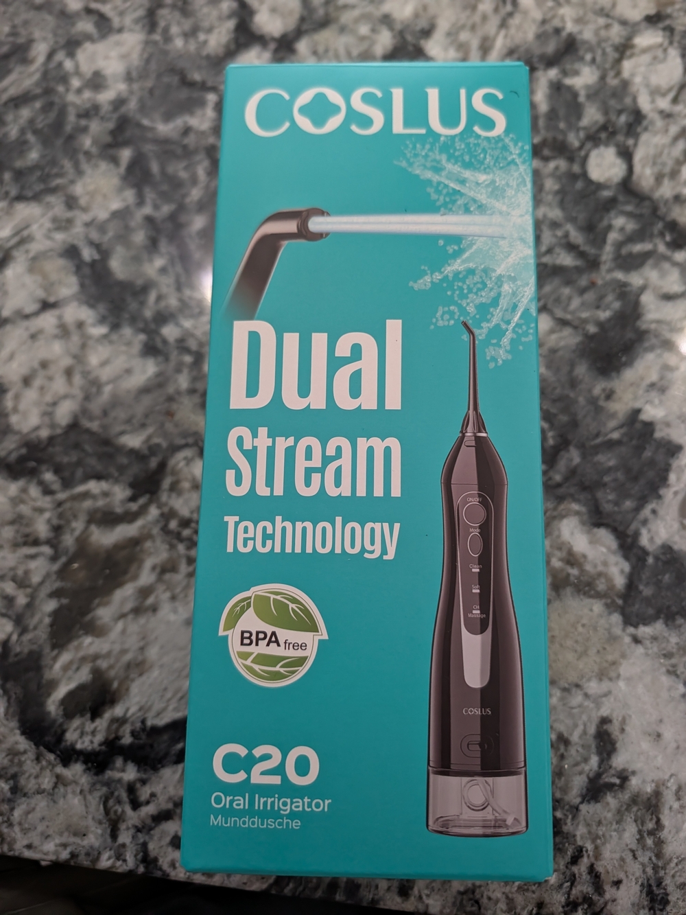 Coslus Black Oral Irrigator with Teal Packaging